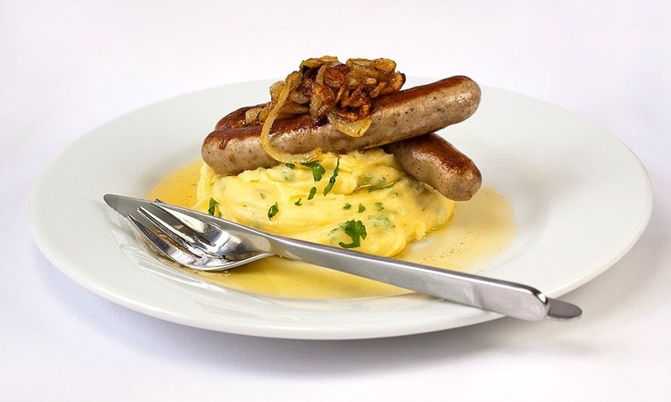 Fried Bratwurst with Mashed Potatoes and Onions